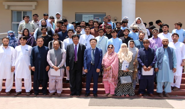 Group_photo_of_chief_guests_Prof_Dr_M_Akram_Shaikh_and_VC_University_of_Haripur_with_faculty_and_participants_at_the_entrepreneurship_seminar_June_14_2022.jpg